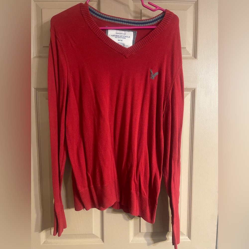 Red vintage fit American eagle size M V-neck sweater.